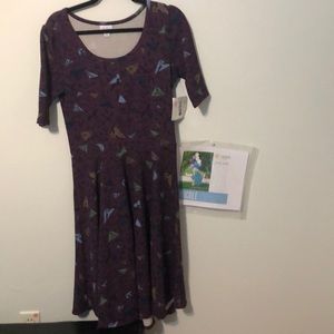 Nicole Fabric: poly and spandex blend Half sleeve